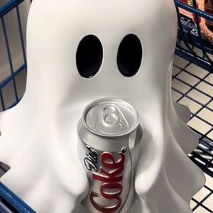 A ghost for Halloween that will fit a coke can beer can Sprite can any can size